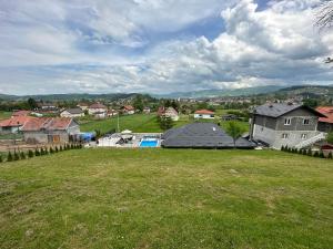 a view of a yard with a house at Villa Coco in Sarajevo