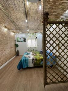 a bedroom with a bed in a room at La Casa Delle Conchiglie in Catania