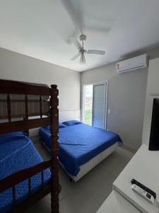 Postel nebo postele na pokoji v ubytování Cobertura Alto Padrão Vista para o Mar - Praia Grande Ubatuba + 12 fotografií