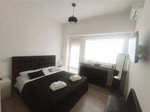 Postel nebo postele na pokoji v ubytování Rooftop Appia antica,silenzioso riservato two bedrooms two bathrooms