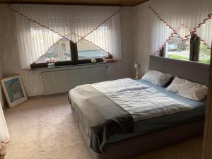 En eller flere senge i et værelse på Marja Ferienwohnung