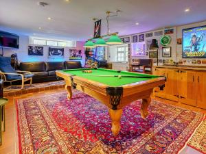 a living room with a pool table in a room at 3 Bed in Crickhowell 48309 