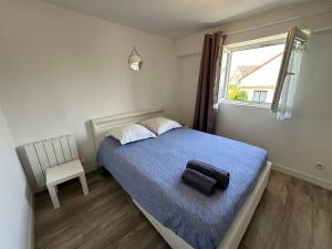 Ένα ή περισσότερα κρεβάτια σε δωμάτιο στο Appartement calme à 20 min de paris et 7’ d Orly