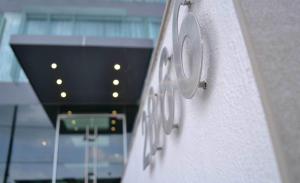 a row of white speakers on the side of a building at Hotel y Tú Expo in Guadalajara