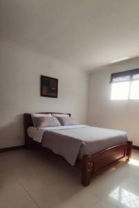 Een bed of bedden in een kamer bij Casa Hotel San Rafael Armenia piso 1
