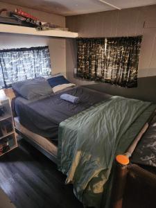 a bedroom with a bed with a bat on it at Co-ed Dorm with Fantastic Patio! in Ewing