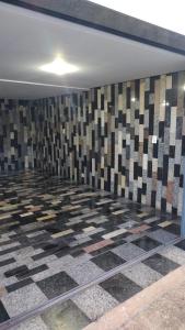a room with a checkered floor in a room at Casa Bela Vista da Serra da canastra in São Roque de Minas