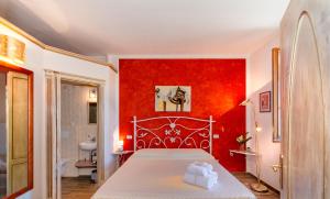 Ένα ή περισσότερα κρεβάτια σε δωμάτιο στο B&B Il Giardino dei Poeti and Apartaments