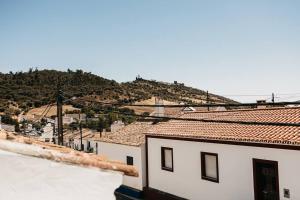 a view of a city from the roof of a building at Casa do Sossego Monsaraz in Monsaraz