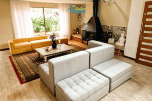 a living room with a couch and a table at Entrebosques in Santa Elena