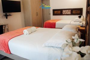 Un pat sau paturi într-o cameră la Entrebosques