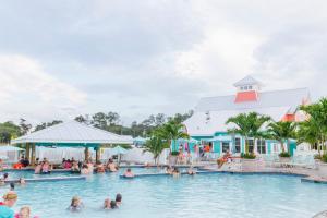 a group of people in the swimming pool at a resort at Sun Outdoors Rehoboth Bay in Millsboro