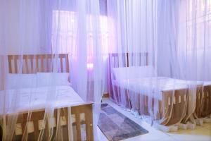 Postel nebo postele na pokoji v ubytování Ahva II Residence