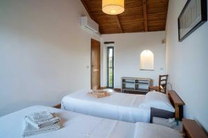 En eller flere senge i et værelse på La Torretta - ACrapa Mangia