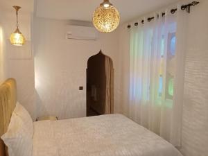 Postel nebo postele na pokoji v ubytování Riad Orient Palace