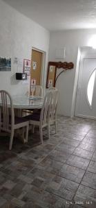 a dining room with a table and chairs at Hostel Dada in Mostar