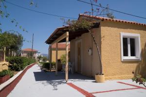 a small building with a door on a street at Aroma Studios in Argostoli +6 photos
