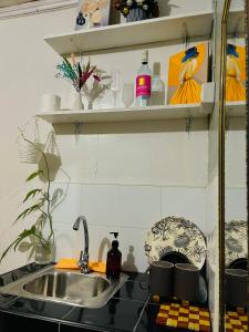 a kitchen with a sink and a counter top at Nordic Style Homestay Davao in Davao City +19 photos