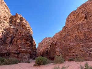 a view of the desert between two rocky mountains at Bedouin lifestyle in Wadi Rum