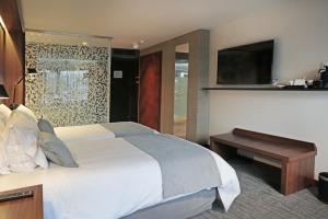 Katil atau katil-katil dalam bilik di Hotel Cumbres Lastarria