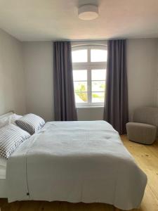 Un pat sau paturi într-o cameră la Ferienhaus Forsthaus Stolpe
