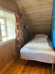 Ένα ή περισσότερα κρεβάτια σε δωμάτιο στο Seaside Cottage