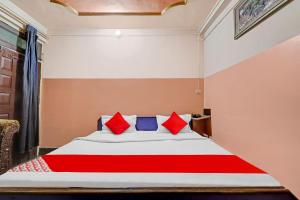 Llit o llits en una habitació de OYO Flagship Vikash Palace