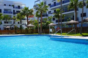 The swimming pool at or close to Aguacate Beach Apartamentos Playa Granada