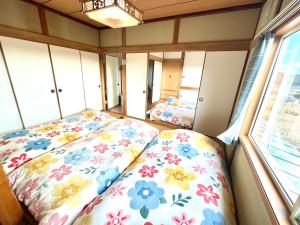 Posteľ alebo postele v izbe v ubytovaní HYUGGE Noboribetsu 2 - Vacation STAY 56362v