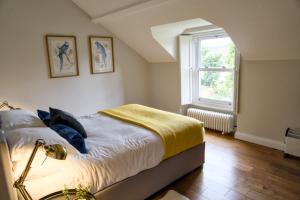 a bedroom with a bed and a window at The Beeches - Chatsworth Apartment No 5 - Sleep2 in Baslow
