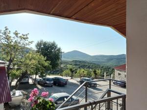 a balcony with a view of a parking lot at Μυρτώ in Kalabaka