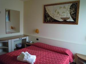 Postel nebo postele na pokoji v ubytování Hotel Xibana
