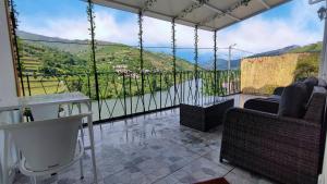 a balcony with a view of a mountain at The River House in Peso da Régua