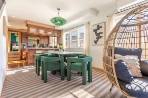 a room with a table and chairs and a kitchen at OCEAN FRONT LUXE Manhattan Beach Strand in Manhattan Beach