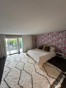 a bedroom with a large bed and a large rug at Condo in Dana Point in Dana Point
