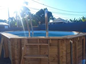 a hot tub with two faucets on top of it at Villa aka merlot in Le Moule