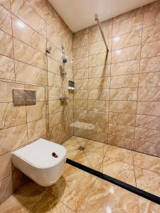 a bathroom with a toilet and a shower at Broken bed hootel in Kaunas