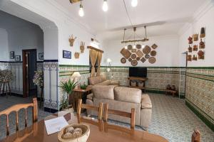 a living room with a couch and a table at La Vaquería in Niebla