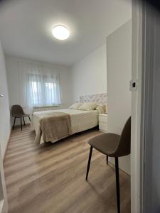 Postel nebo postele na pokoji v ubytování La Alameda