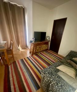Ein Bett oder Betten in einem Zimmer der Unterkunft Apartamento Edifício Quitandinha