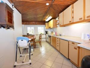 a kitchen with a table and a dining room at Ferienhaus Anna 1 in Jindřichovice