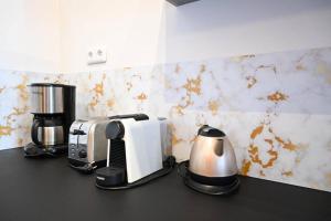 a kitchen counter with a toaster and a coffee maker at LE BOBO - Vieux-Port in Marseille