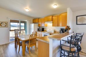 a kitchen and dining room with a table and chairs at Tranquil Cabin Getaway w/ Panoramic Mtn View! in Antero Junction