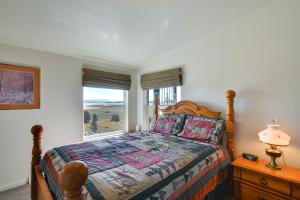 a bedroom with a bed and a window at Tranquil Cabin Getaway w/ Panoramic Mtn View! in Antero Junction