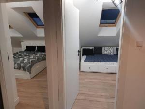 a bedroom with a bed and two beds in it at Apartament z dużym tarasem, bezpłatny parking, AWG APARTMENTS in Kraków +22 photos