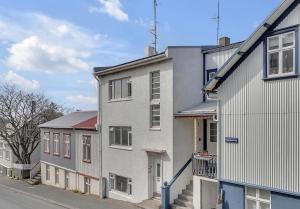 a group of buildings on a city street at Central Pearl Apartment in Reykjavík