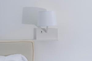Postel nebo postele na pokoji v ubytování Sunbliss Capri