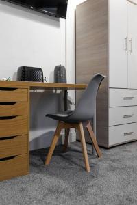 a chair sitting at a desk in an office at City Centre Studio 8 with Kitchenette, Free Wifi and Smart TV by Yoko Property in Middlesbrough