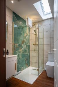a bathroom with a shower with a glass door at Heather Nook- luxury studio in Pitlochry in Pitlochry