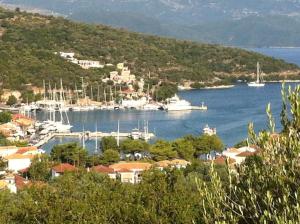 a view of a harbor with boats in the water at Happy House-Comfortable Apartment in Vathi Square in Meganisi
